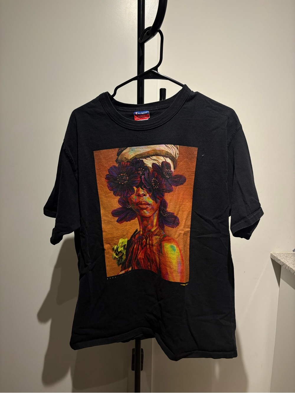 Champion Black T‑Shirt Print with Purple and Orange Floral Portrait